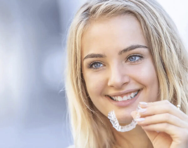 Portrait of smiling child with braces in dentist's office